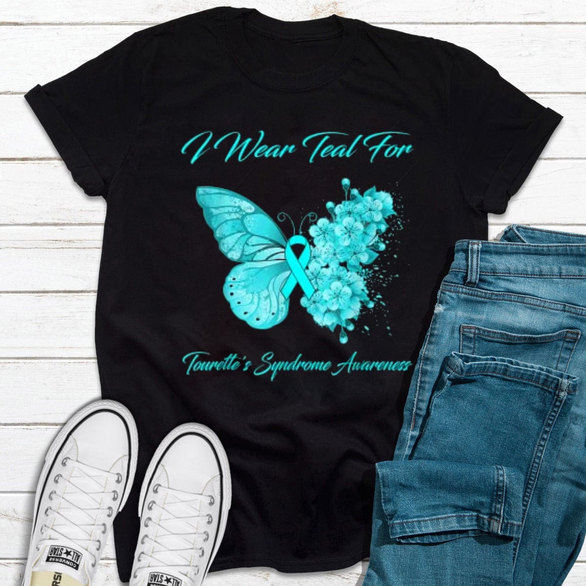 Camiseta con la frase "I Wear Teal" (Mariposa que uso verde azulado para concienciar sobre el síndrome de Tourette)