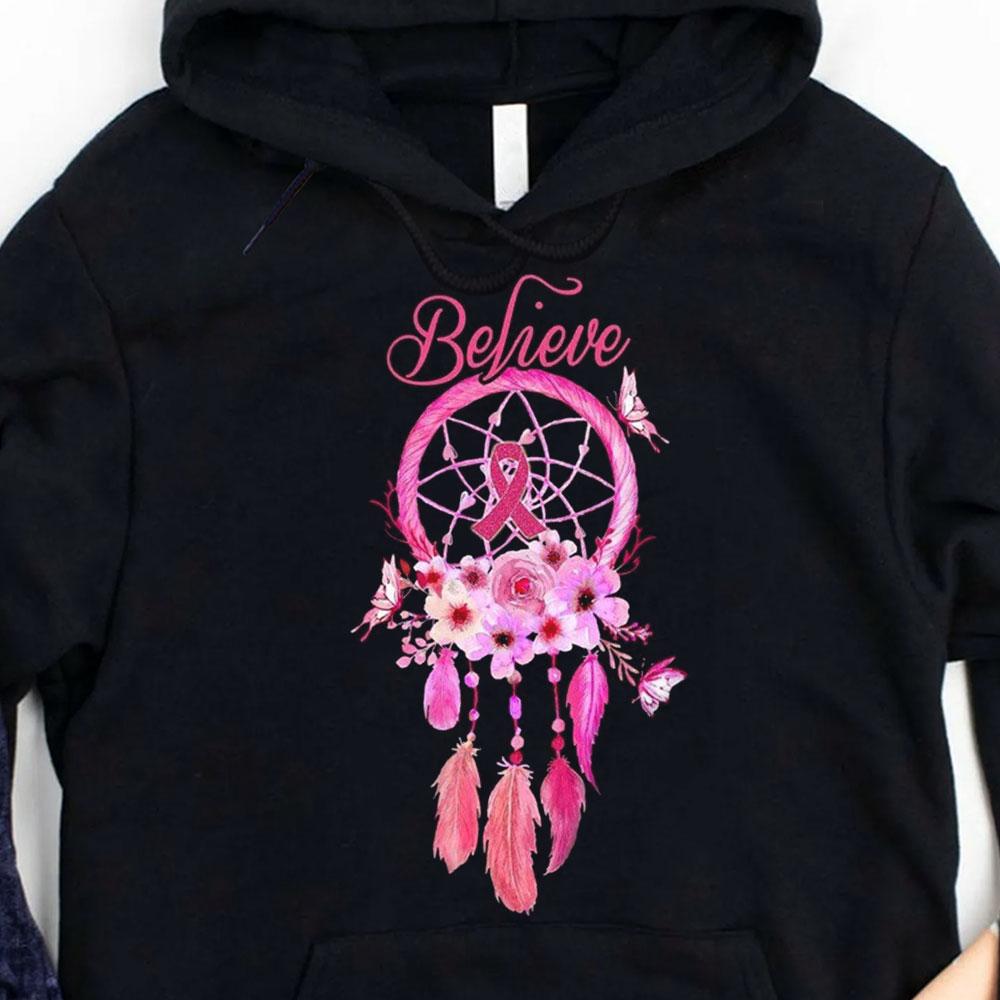 Believe, camisetas con lazo rosa contra el cáncer de mama