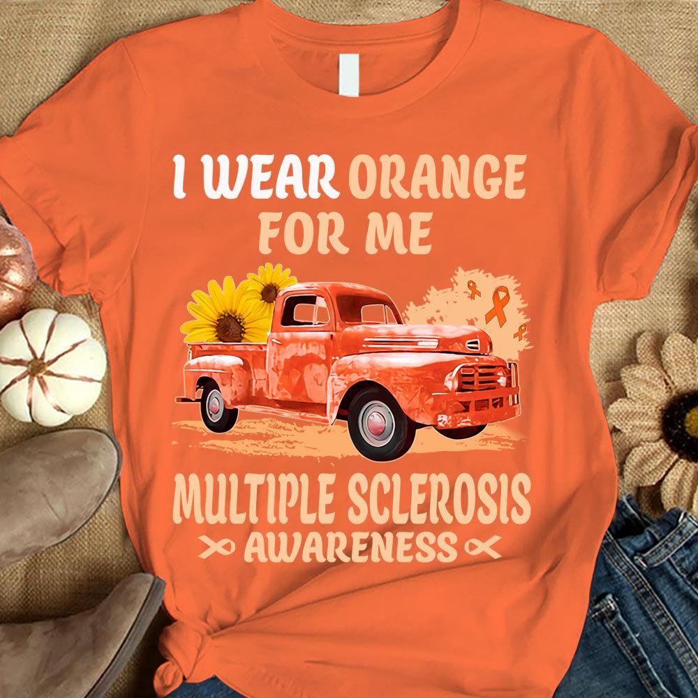 Camiseta de apoyo a la concienciación sobre la esclerosis múltiple con el lema "I Wear Orange For Me", cinta con girasol y coche