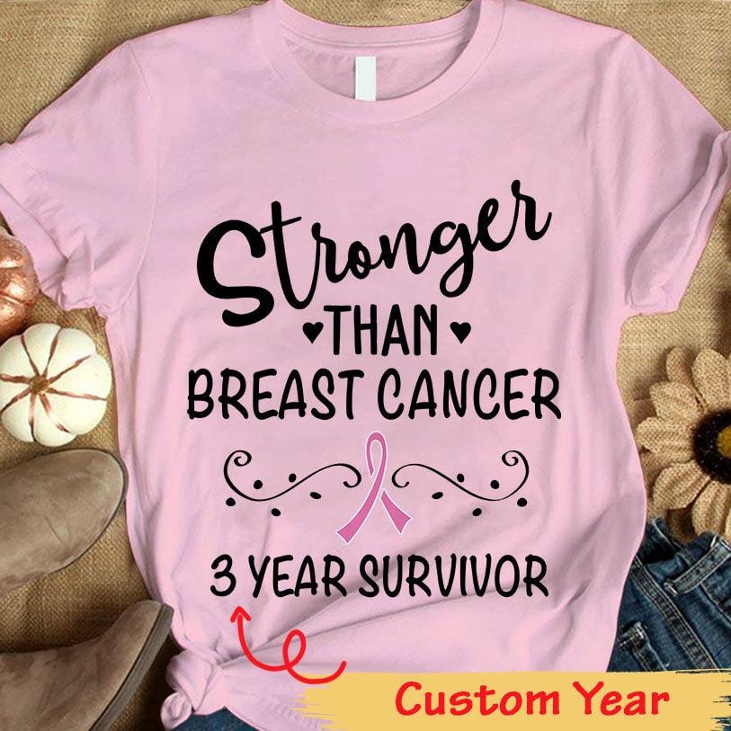 Camiseta personalizada con lazo rosa y texto "Más fuerte que el cáncer de mama" para sobrevivientes del cáncer de mama