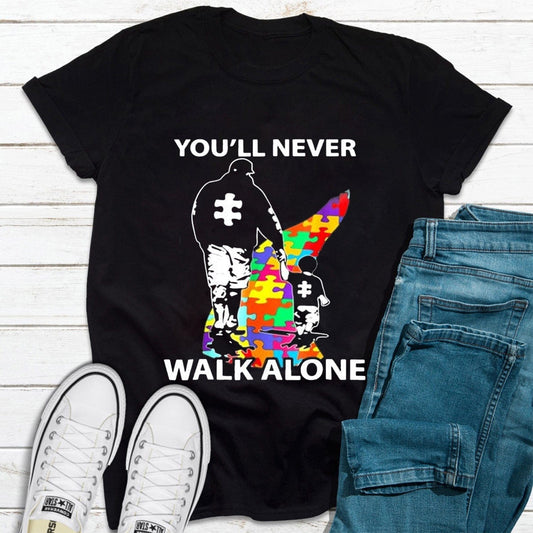 Camiseta de concienciación sobre el autismo "Nunca caminarás solo", padre e hijo