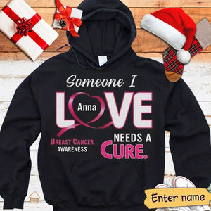 Sudadera con capucha y camisetas personalizadas para el cáncer de mama con la frase Alguien a quien amo necesita una cura