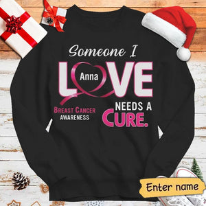 Sudadera con capucha y camisetas personalizadas para el cáncer de mama con la frase Alguien a quien amo necesita una cura