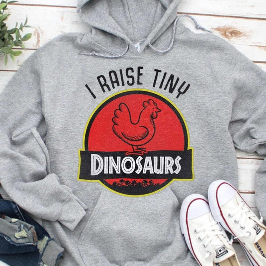Sudadera con capucha y camiseta con el mensaje "I Raise Tiny Dinosaurs Chicken"