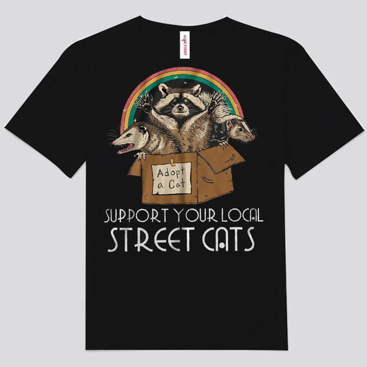 Camisetas de mapache arcoíris con el logo de "Apoya a tus gatos callejeros locales"