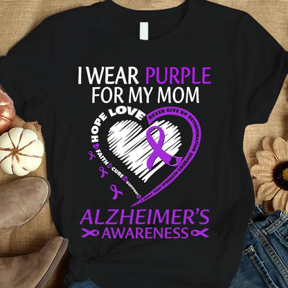 Sudadera y camisas con el mensaje "Llevo morado por mamá con mi corazón Alzheimer"