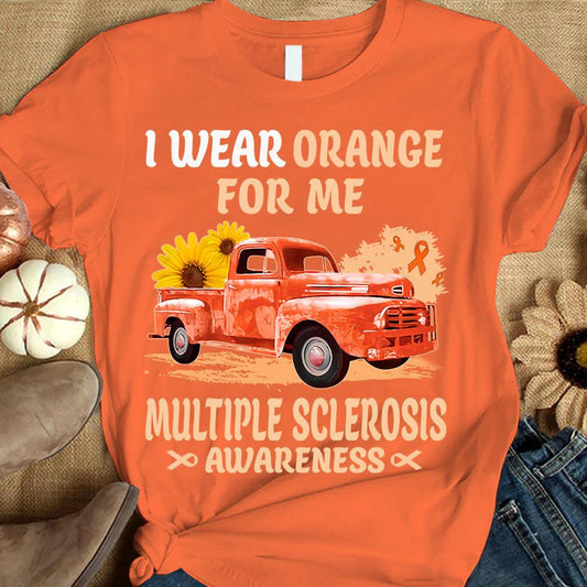Camiseta de apoyo a la concienciación sobre la esclerosis múltiple con el lema "I Wear Orange For Me", cinta con girasol y coche