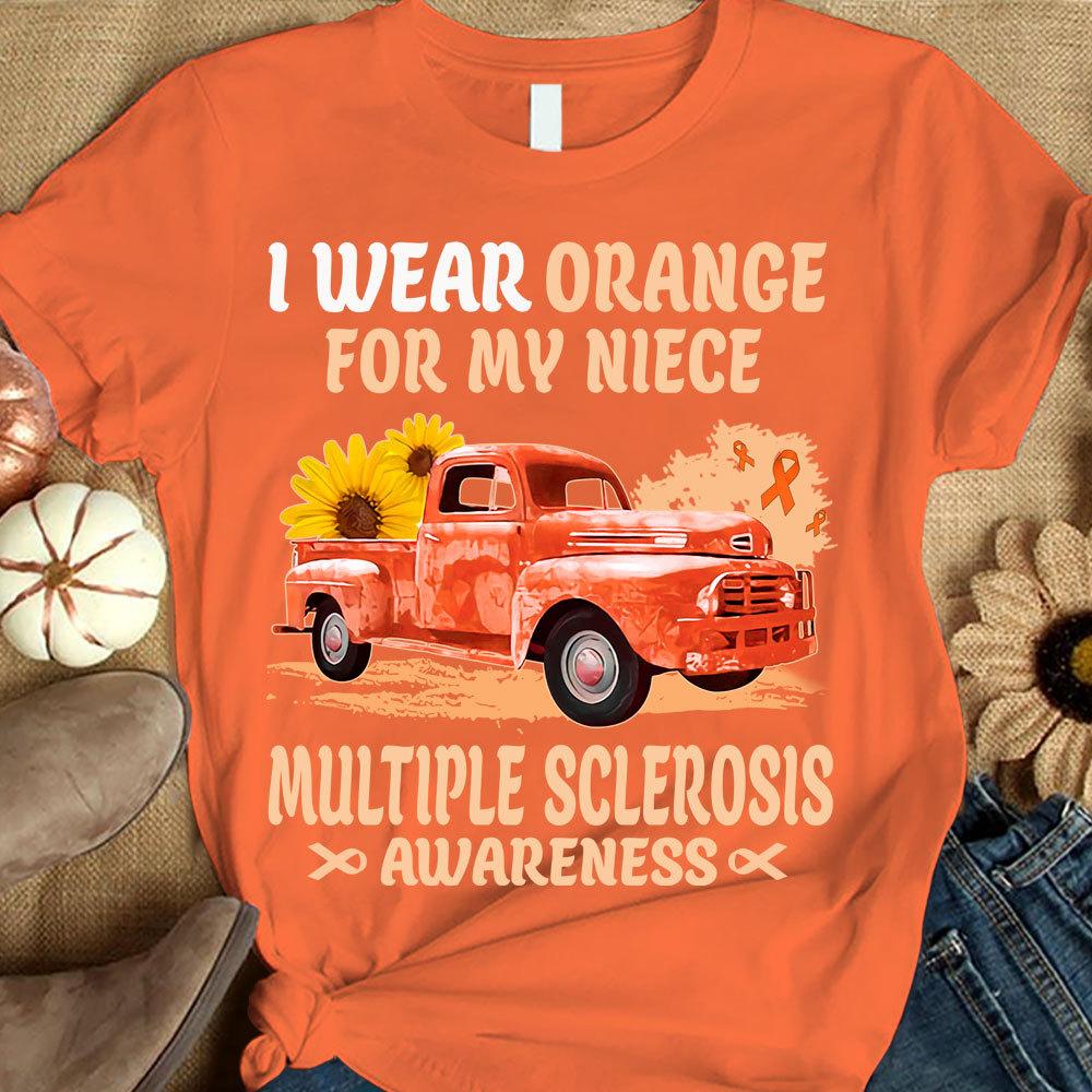 Llevo naranja por mi sobrina, camiseta con lazo, girasol y coche, para concienciar sobre la esclerosis múltiple